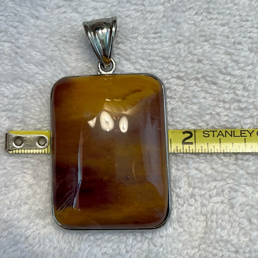 Polished brown stone pendant